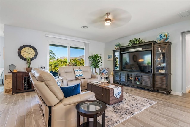 5990 Bearberry Dr, Vero Beach, FL 32967 - living room with light wood-style flooring and a ceiling fan