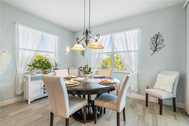 dining space featuring light wood-type flooring