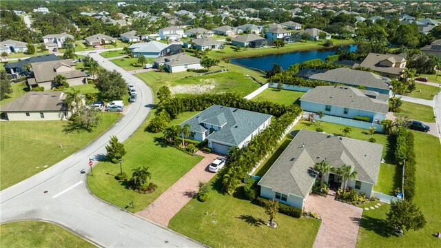 birds eye view of property with a water view