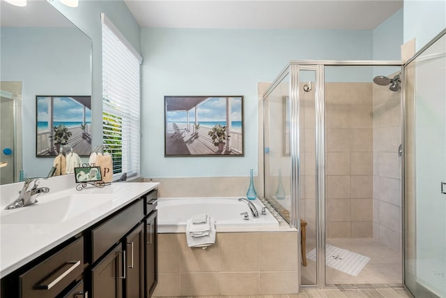 bathroom with shower with separate bathtub and vanity