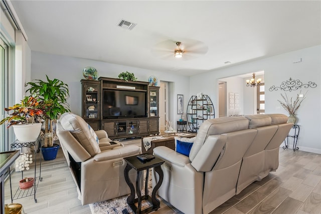 living room featuring a notable chandelier