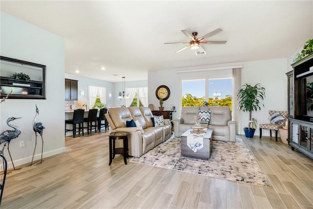 5990 Bearberry Dr, Vero Beach, FL 32967 - living room with light wood-style floors, a ceiling fan, baseboards, and recessed lighting
