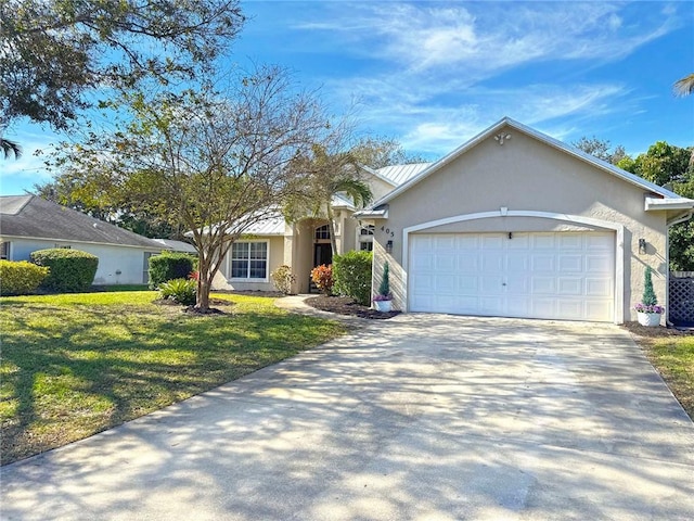 ranch-style home featuring a garage and a front lawn