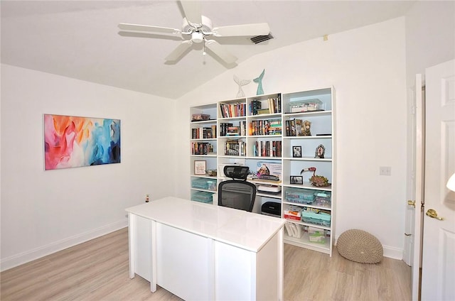 office featuring lofted ceiling, light hardwood / wood-style floors, and ceiling fan