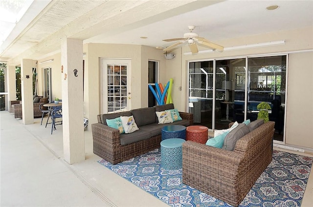 view of patio with ceiling fan and an outdoor living space