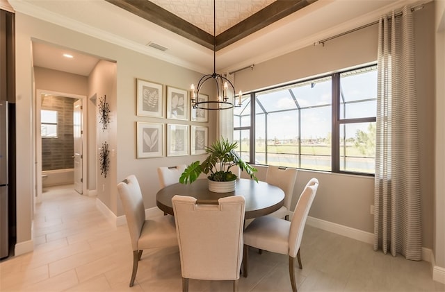 dining area featuring plenty of natural light and a notable chandelier