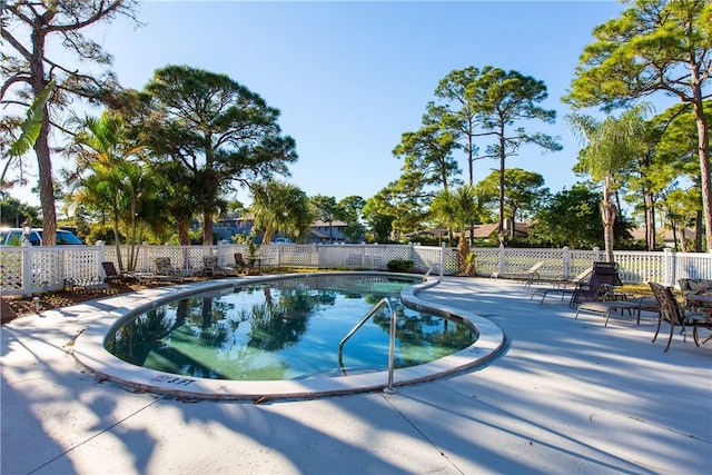 view of swimming pool with a patio area