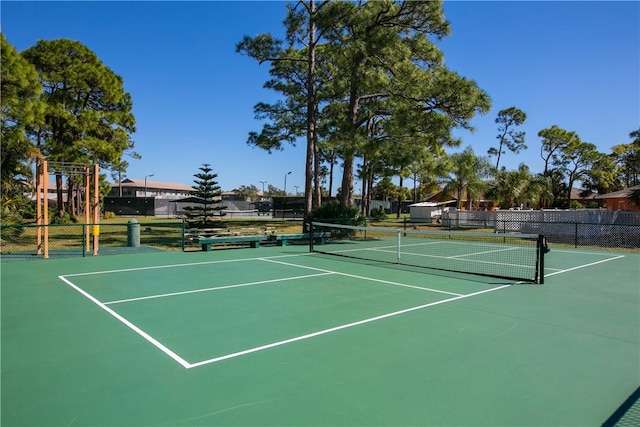 view of tennis court featuring basketball court