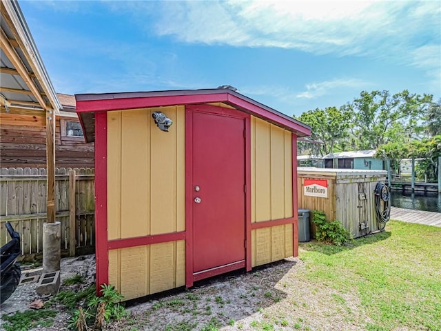 view of shed with fence