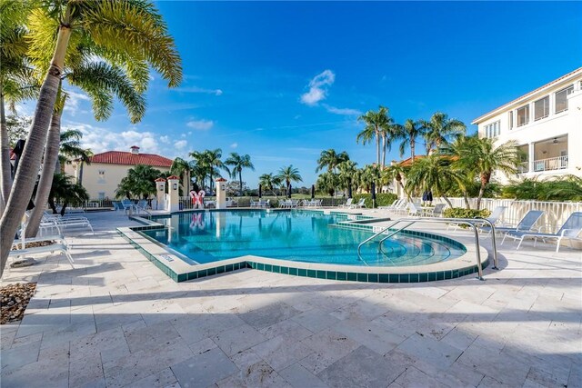5040 Harmony Cir Unit 205, Vero Beach, FL 32967 - community pool featuring a patio