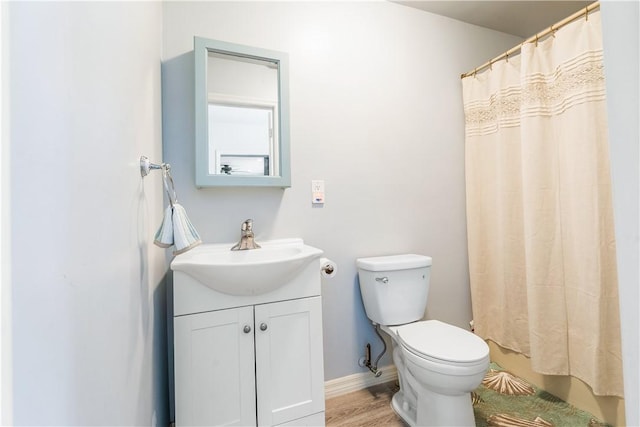 1717 20th Ave, Vero Beach, FL 32960 - full bath featuring vanity, a shower with curtain, and wood finished floors