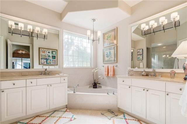 bathroom with tile patterned floors, vanity, and separate shower and tub