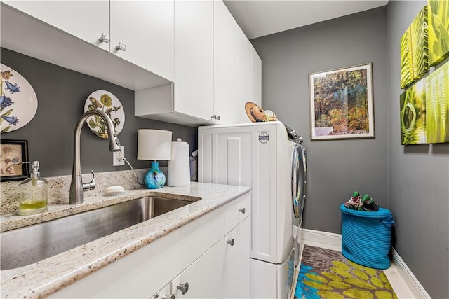 washroom featuring cabinets, tile patterned floors, and sink