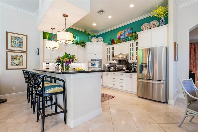 kitchen featuring hanging light fixtures, stainless steel fridge with ice dispenser, backsplash, a breakfast bar area, and white cabinets