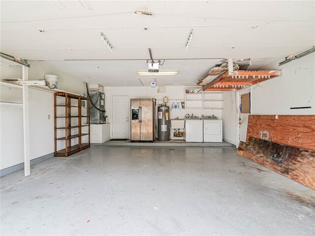 garage with stainless steel fridge with ice dispenser, heating unit, electric water heater, a garage door opener, and washing machine and clothes dryer