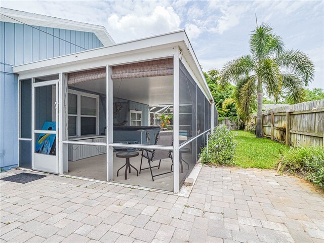 view of patio / terrace with a lanai and a sunroom