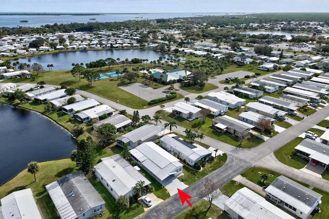 drone / aerial view with a water view