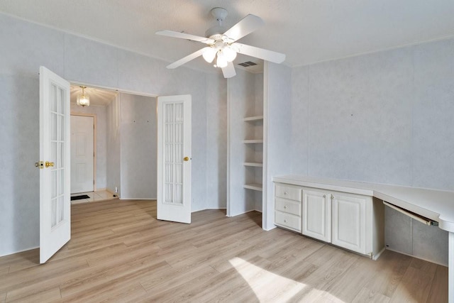 unfurnished bedroom with french doors, ceiling fan, and light hardwood / wood-style flooring