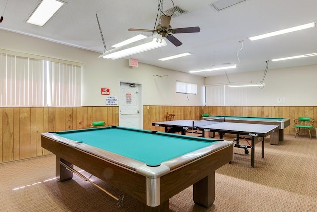 playroom featuring pool table, light colored carpet, wooden walls, and ceiling fan