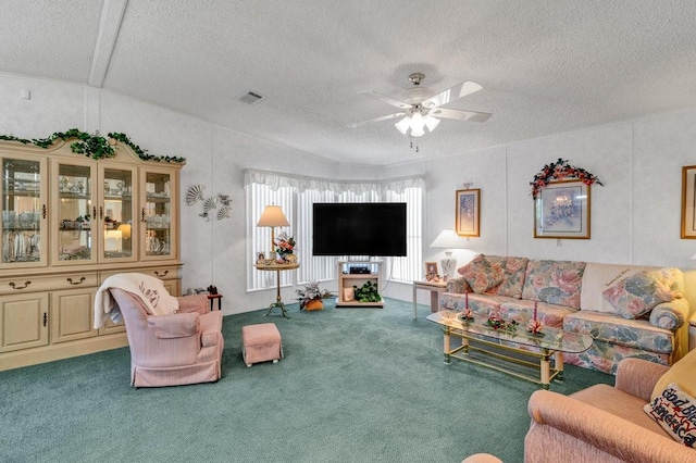 carpeted living room with lofted ceiling, a textured ceiling, and ceiling fan