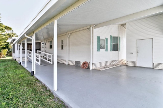 exterior space featuring a carport