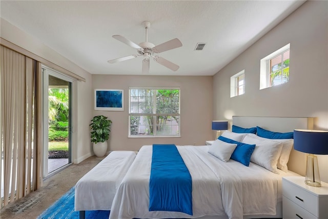 carpeted bedroom with ceiling fan and access to exterior