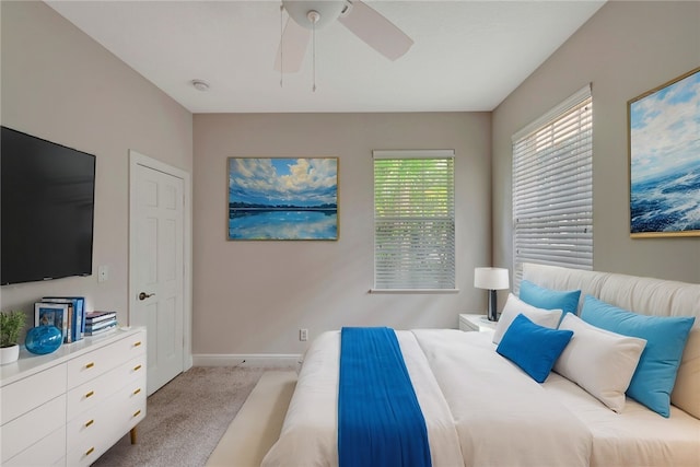 bedroom with ceiling fan and light colored carpet