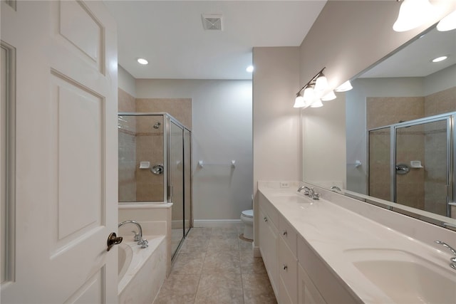 full bathroom featuring toilet, vanity, tile patterned floors, and separate shower and tub