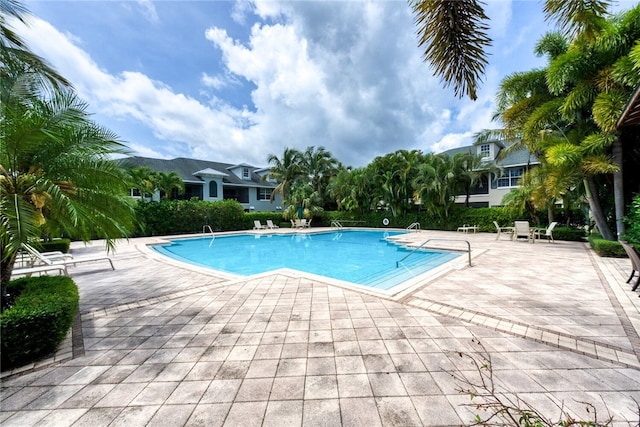 view of swimming pool featuring a patio