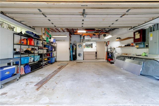 garage with electric panel, water heater, and stacked washing maching and dryer