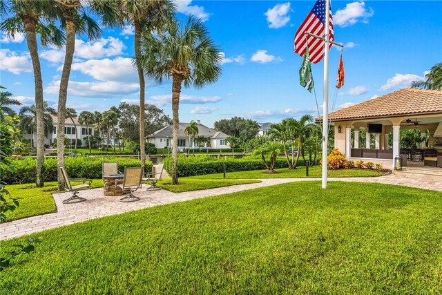 740 Lagoon Rd, Vero Beach, FL 32963 - view of community with a yard, a patio area, and a residential view