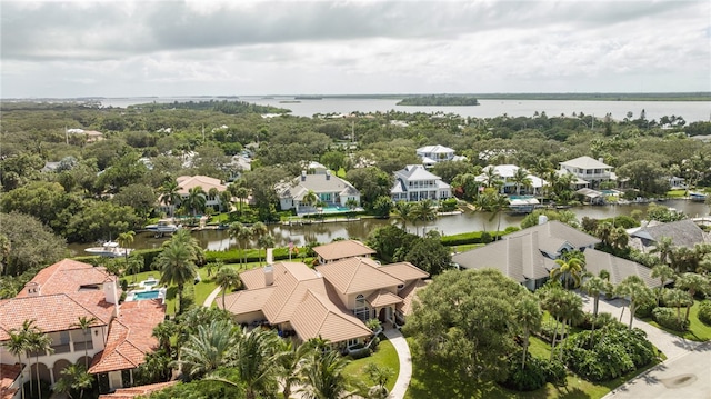 birds eye view of property featuring a water view