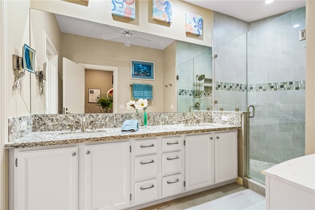 bathroom with tile patterned floors, ceiling fan, vanity, and walk in shower