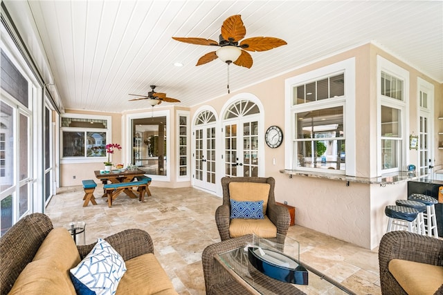 sunroom / solarium featuring wooden ceiling and french doors