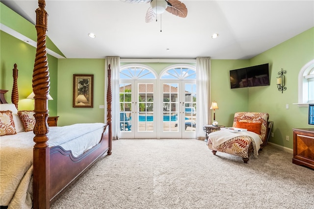 bedroom featuring carpet, lofted ceiling, access to outside, french doors, and ceiling fan