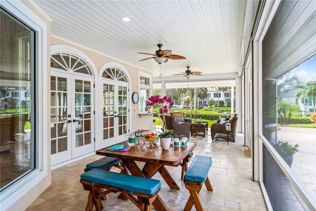 sunroom / solarium with french doors, ceiling fan, and wood ceiling