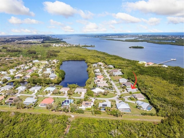 birds eye view of property featuring a water view