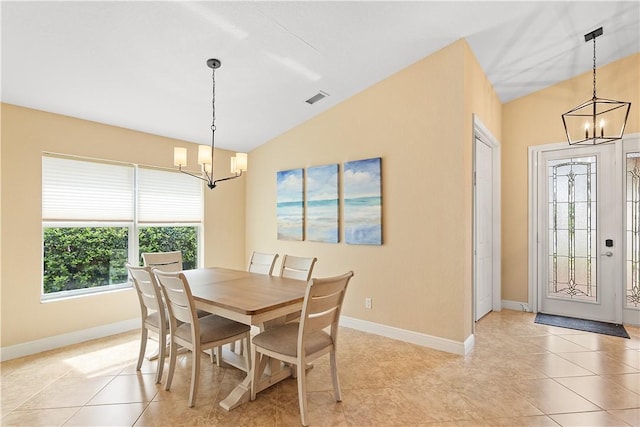 dining area featuring a chandelier, light tile patterned floors, lofted ceiling, and visible vents