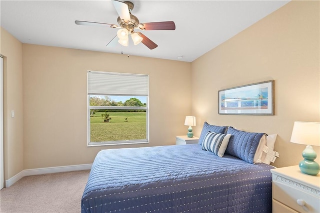 bedroom featuring a ceiling fan, carpet, and baseboards