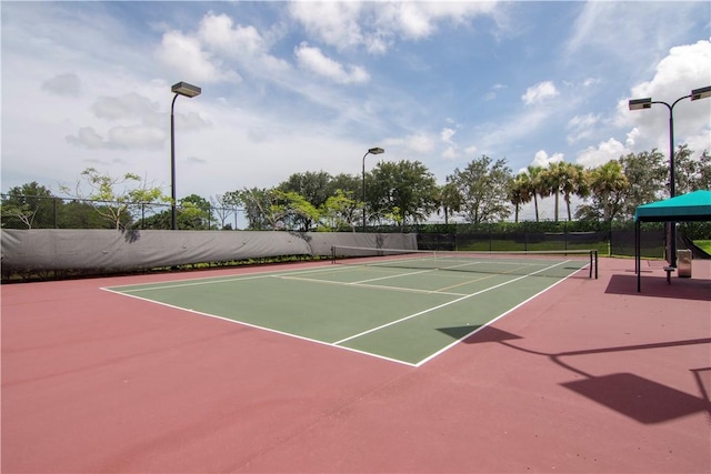 view of sport court featuring community basketball court and fence