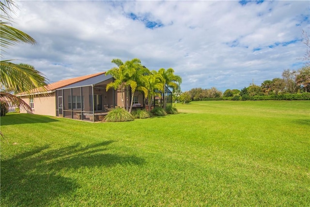 view of yard with a sunroom