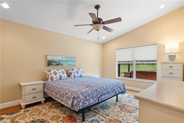 bedroom with lofted ceiling, light wood-style flooring, baseboards, and recessed lighting