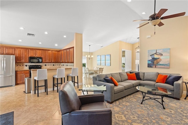 living room with lofted ceiling, recessed lighting, visible vents, and ceiling fan with notable chandelier