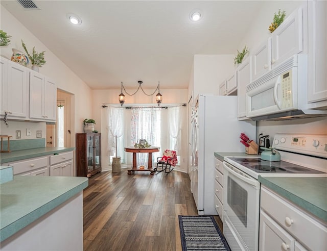 kitchen featuring white cabinets, white appliances, dark wood-type flooring, and lofted ceiling