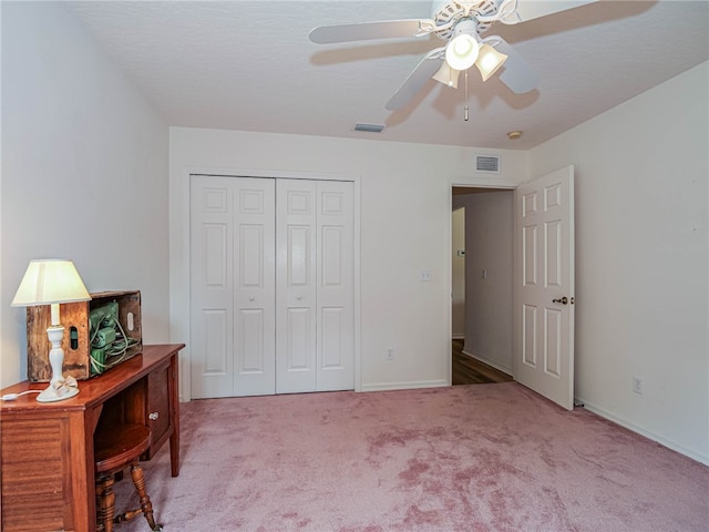 bedroom with ceiling fan, a closet, and carpet floors