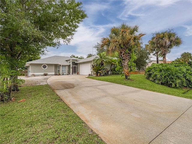 view of front of house with a garage and a front yard