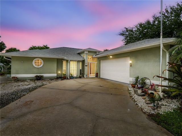 single story home featuring a garage