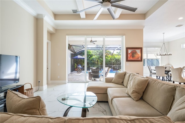 living room featuring ceiling fan with notable chandelier and ornamental molding