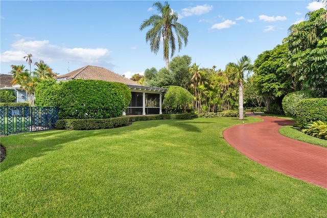 view of yard featuring a sunroom