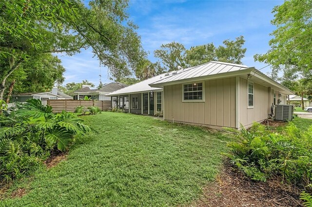 435 61st Ave, Vero Beach, FL 32968 - rear view of property featuring central AC unit, a standing seam roof, and metal roof